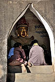 Old Bagan Myanmar. The Tharaba Gateway, shrine containing images of nats. 